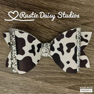 Faux leather cow print hair bow